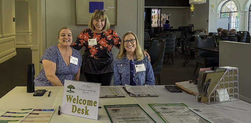 Photo of people at the welcome desk